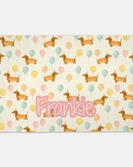 Placemat with dachshund pattern and 'Frankie' text on a white background