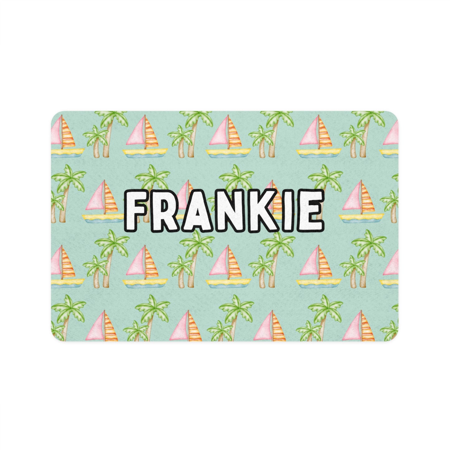 Pet food mat with a seafoam background featuring an adorable coastal print of pink sailboats and green palm trees, personalized with your pet's name exclusively by My Doxie Depot.