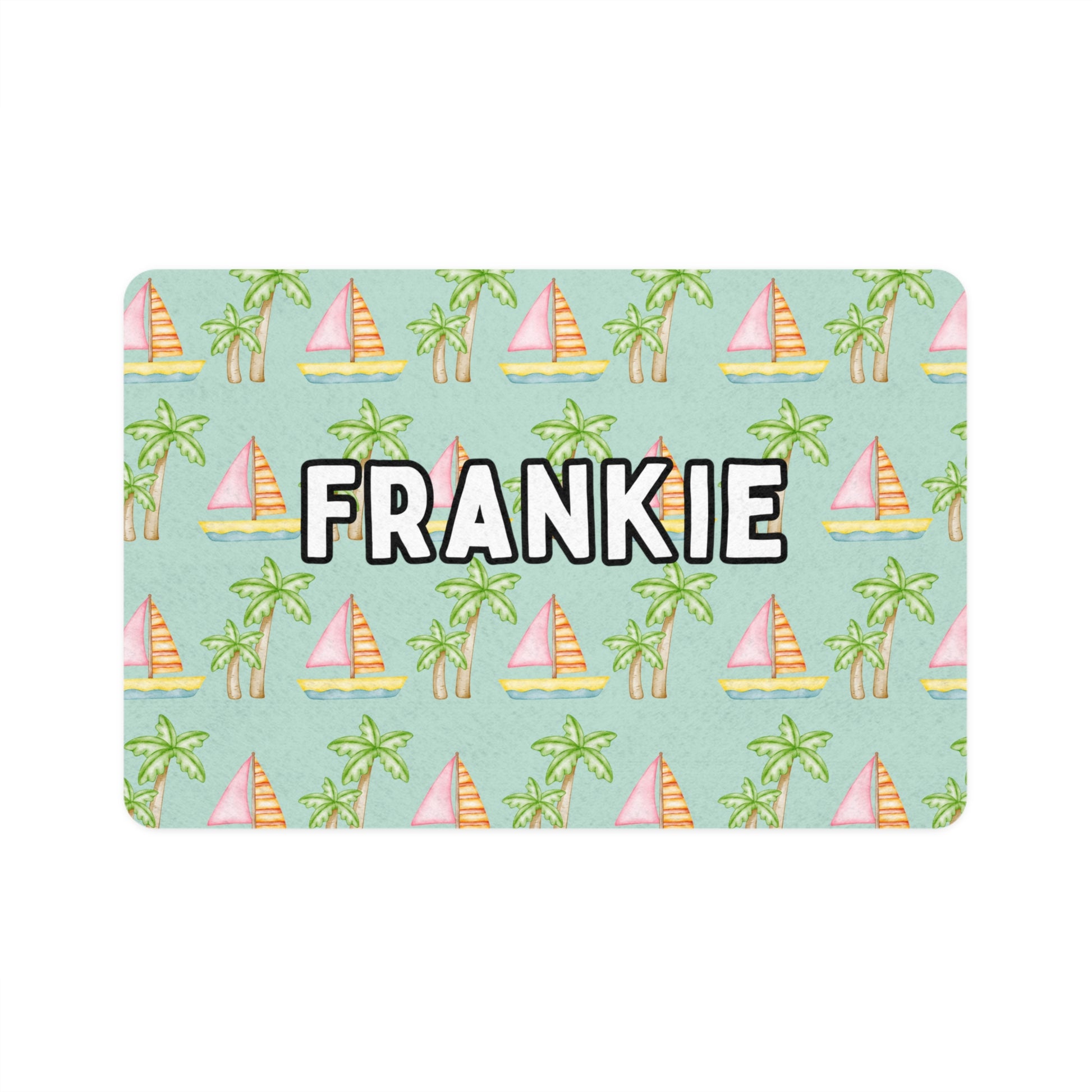 Pet food mat with a seafoam background featuring an adorable coastal print of pink sailboats and green palm trees, personalized with your pet's name exclusively by My Doxie Depot.