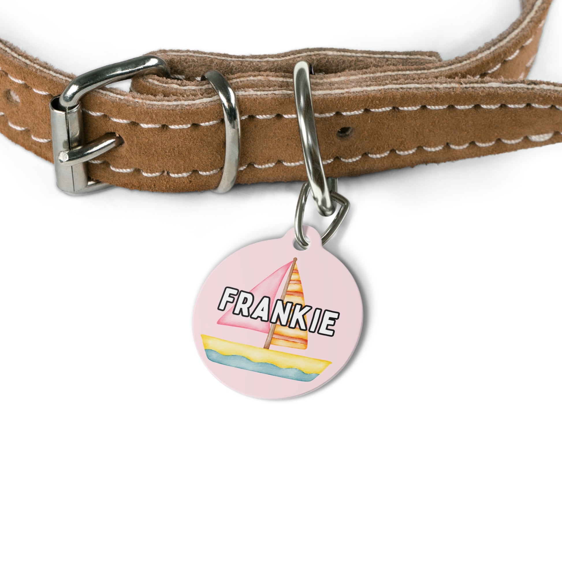 Customizable pink pet tag featuring pink sailboats, green palm trees, and your pet’s name, with a durable metal construction and clip by My Doxie Depot