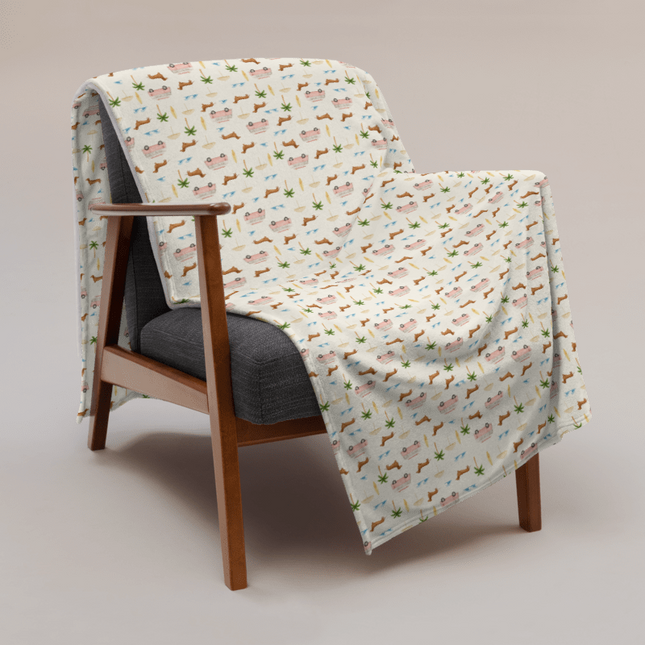Coastal dachshund blanket draped over chair in lifestyle photo with surf van print