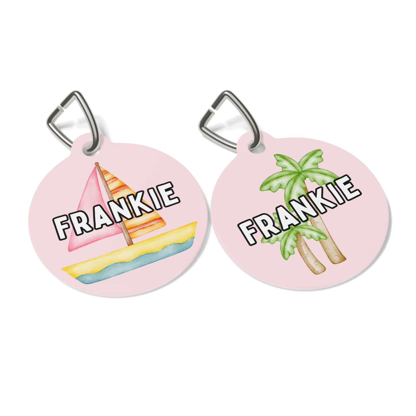 Customizable pink pet tag featuring pink sailboats, green palm trees, and your pet’s name, with a durable metal construction and clip by My Doxie Depot