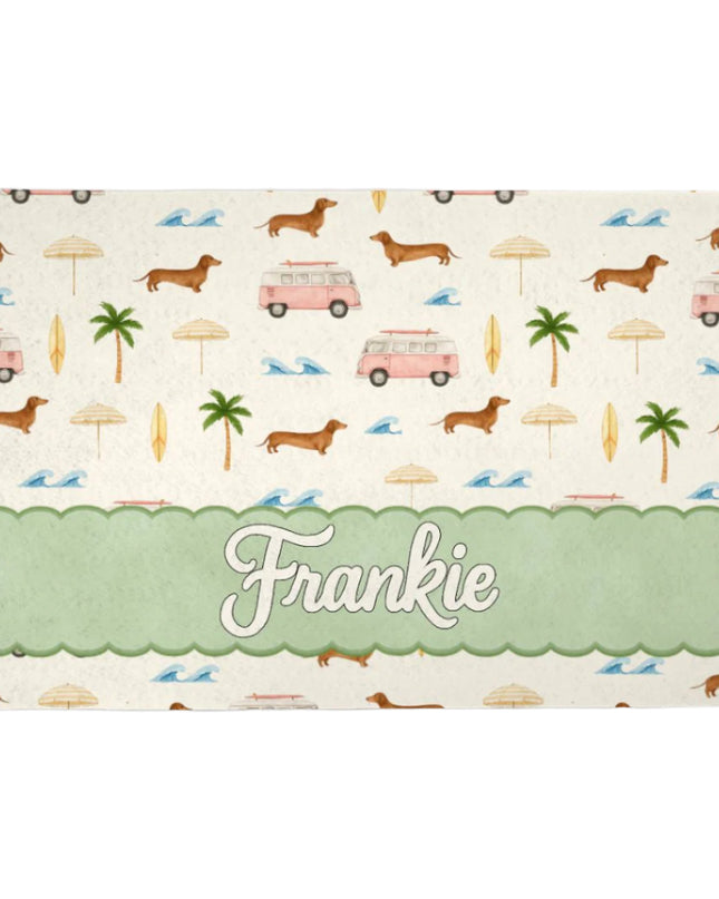 Personalized pet feeding mat with dachshund pattern and 'Frankie' text on a white background